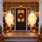 Two Festwick GlowSwing ghosts hung either side of a front door