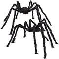 Two hairy black spiders with red eyes